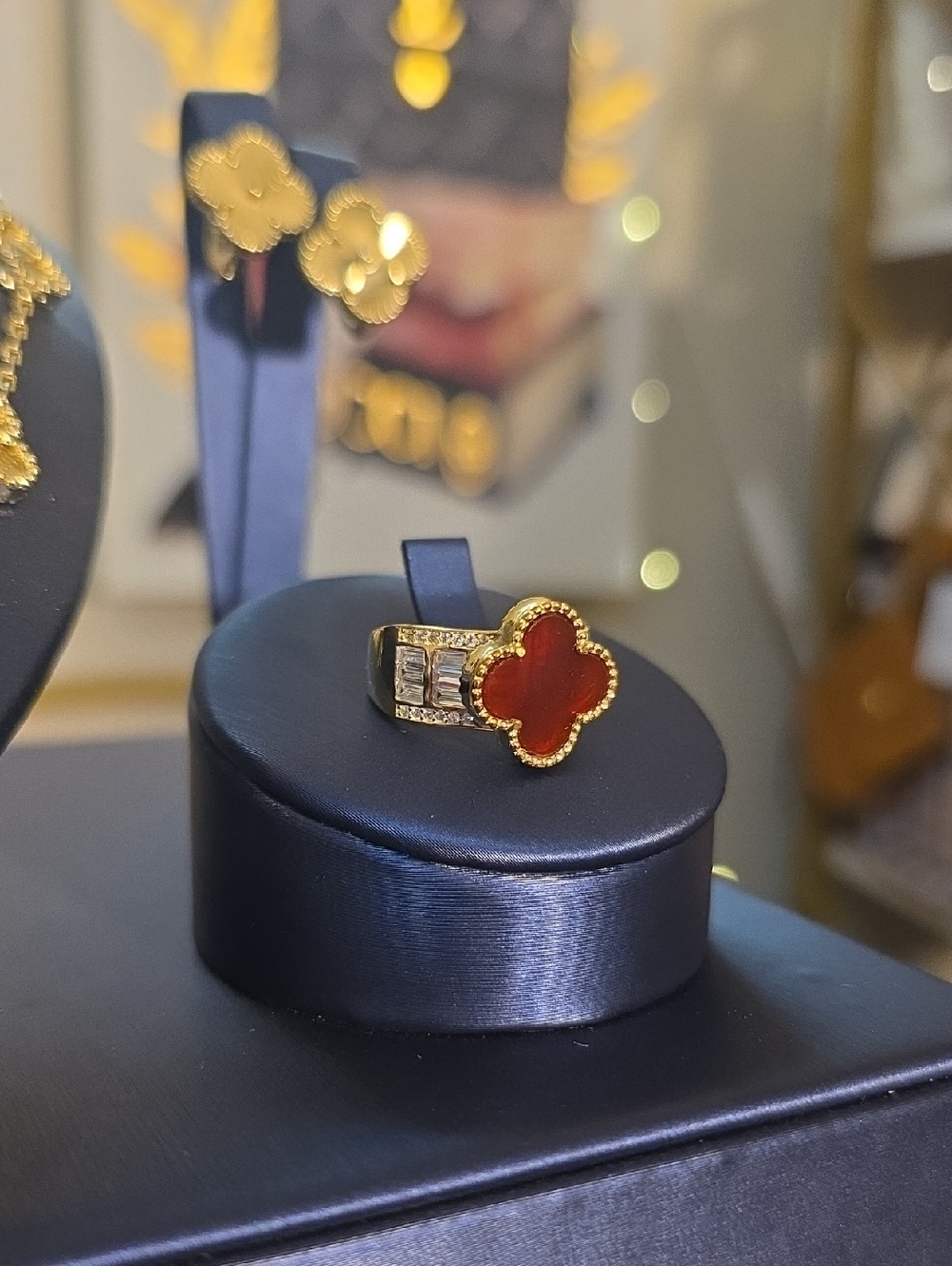 Gold Sterling Silver Ring with Red Four-Leaf Motif and Crystal Accents